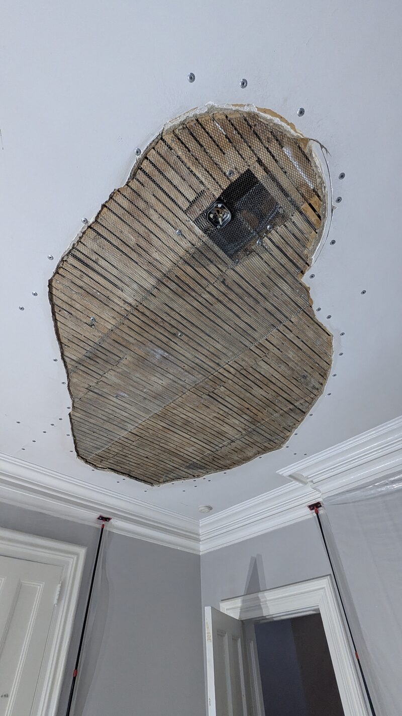 Mesh installed over original wood lath for plaster patch in Hudson Valley NY historic home